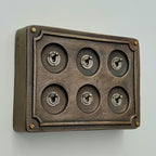 Brassvane 6 gang conduit light switch overall view
