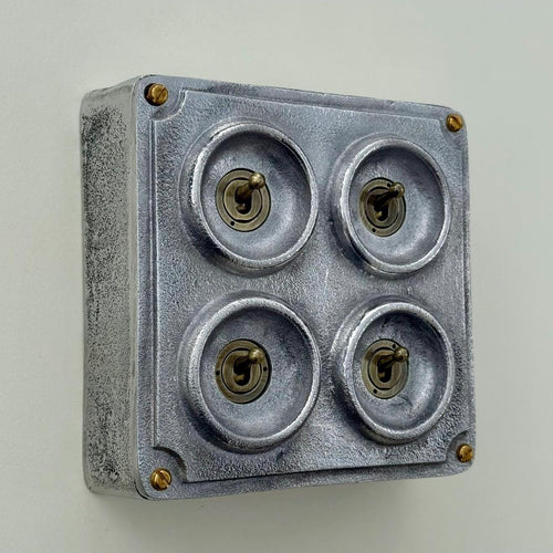 Brassvane 4 gang conduit light switch overall view