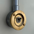 Brassvane raw brass conduit light switch overall view